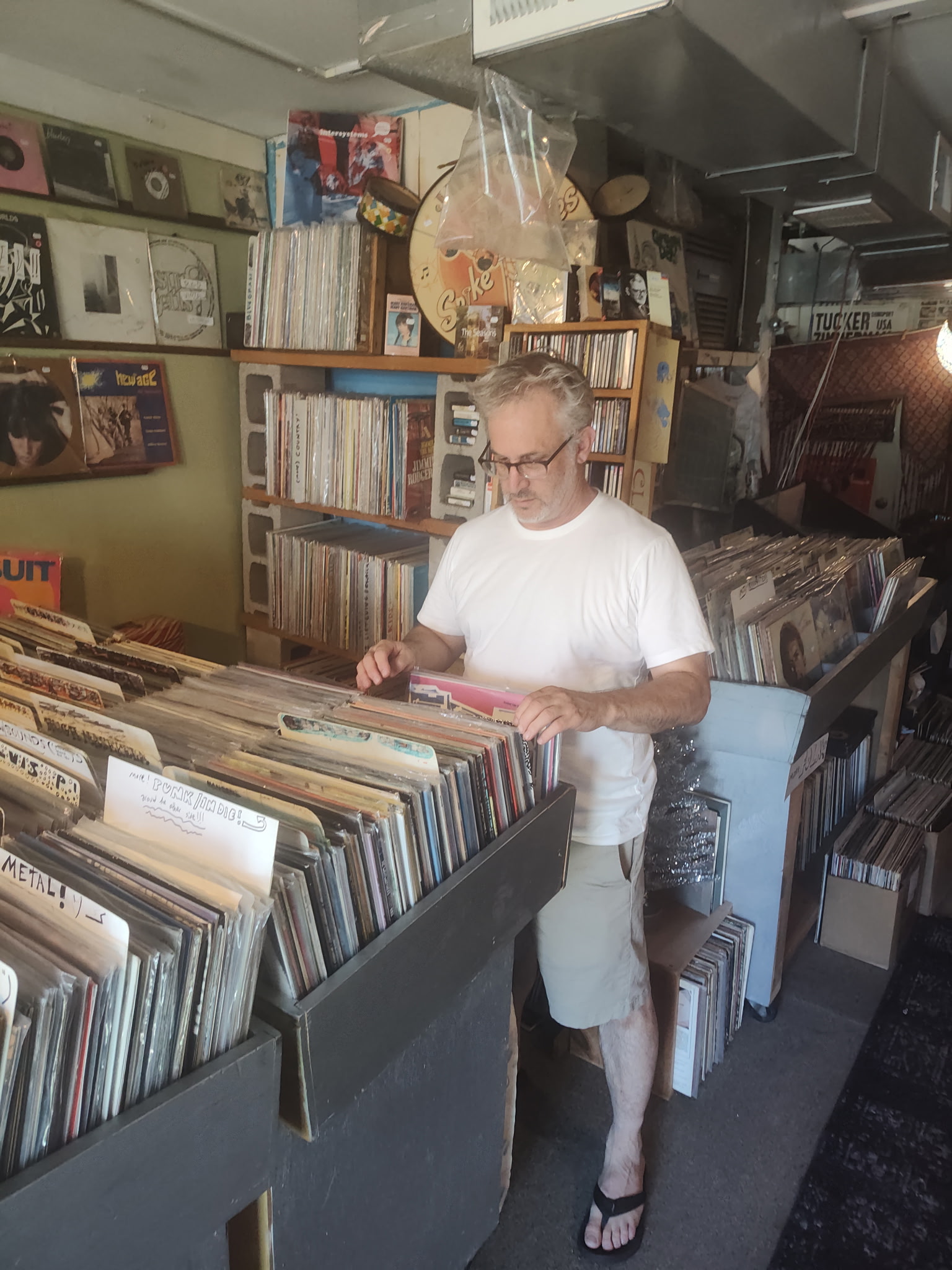 Aaron Meskin looking at records
