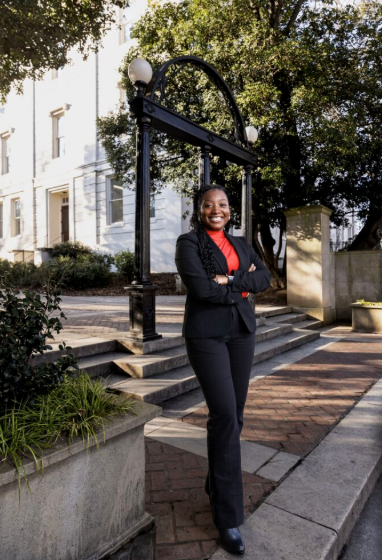 photo of woman, day, arch in background