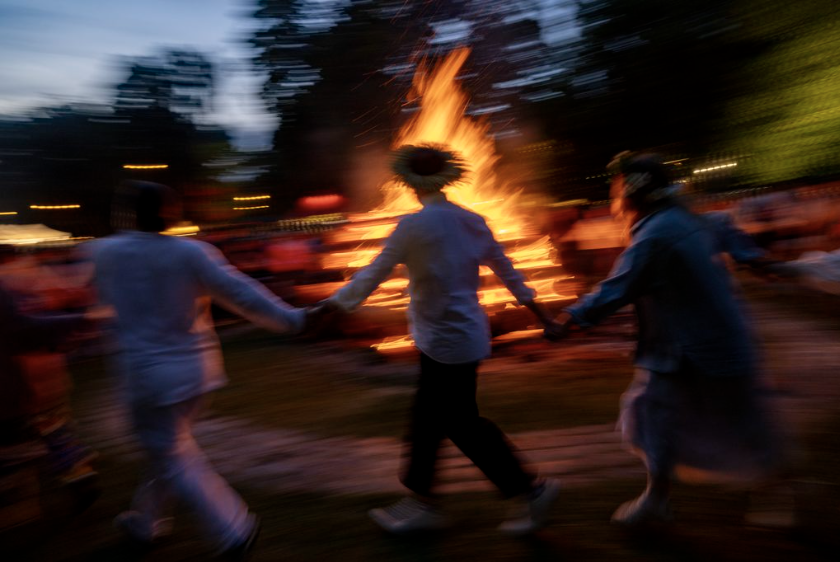 Revelers dance through the night during Līgo, the Latvian solstice celebration.