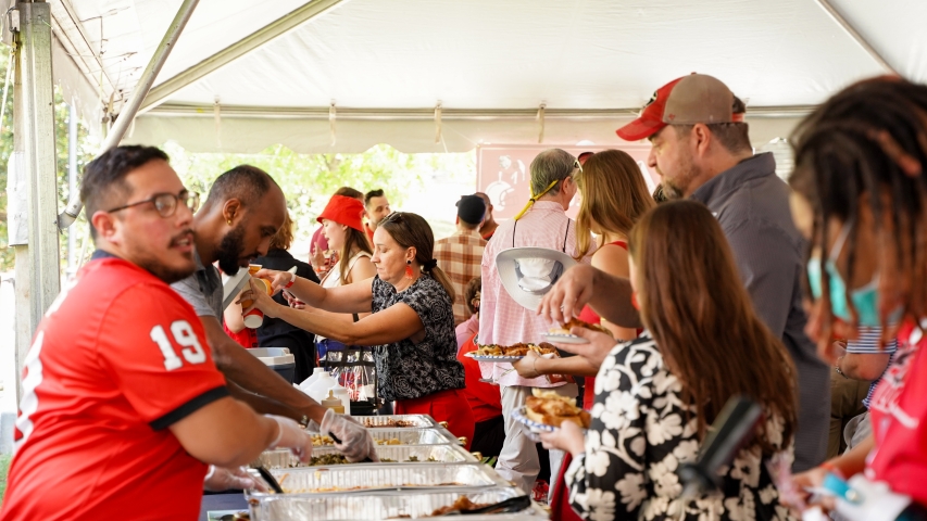 photo of people and food table