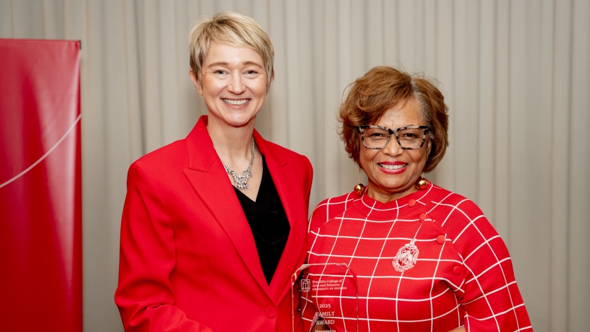 Photo of two women holding award