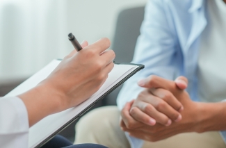 photo of hands with clipboard