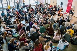 photo of room with students and speaker