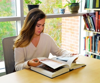 photo of woman with book