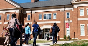 people walking, building