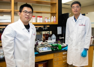 Photo of two men in lab coats