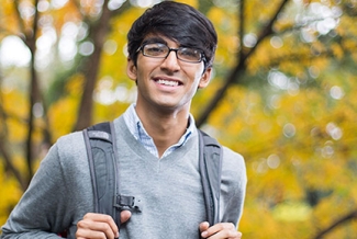 man outside with backpack