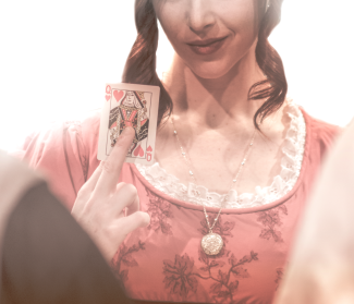 promo photo of woman holding playing card