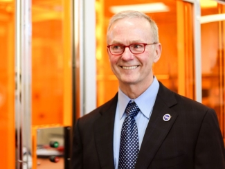 photo of man next to clean room facility 