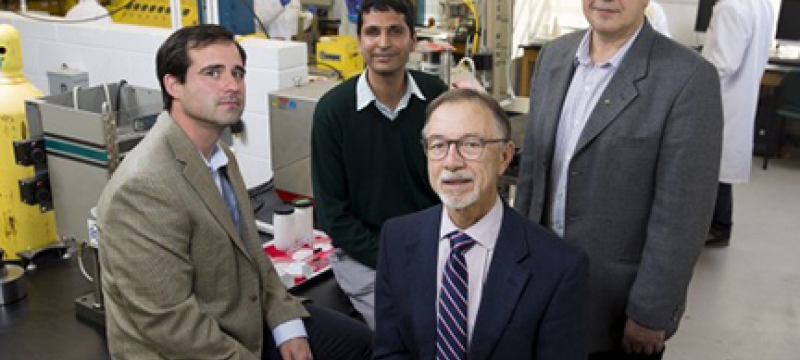 four men in a lab