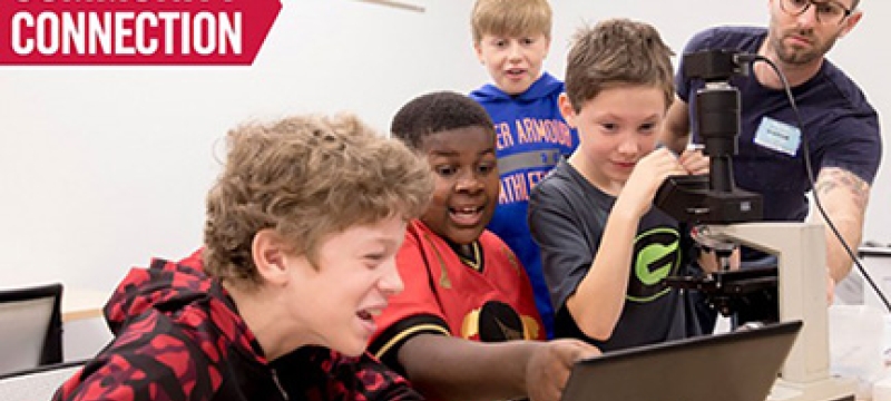 photo of kids with microscope and computer