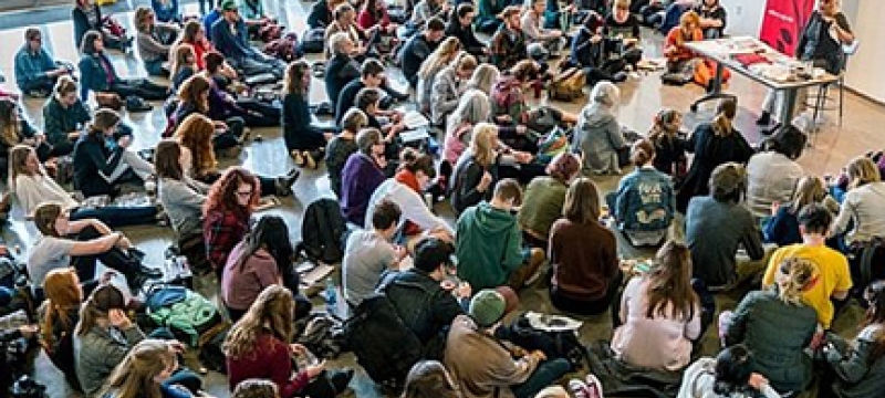 photo of room with students and speaker
