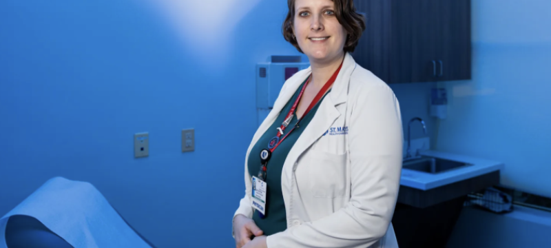 photo of doctor in examine room, blue tint
