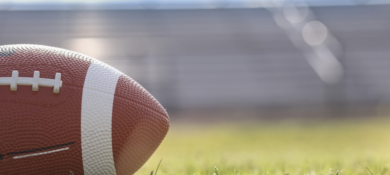 stock photo of football on grass field