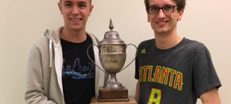 two men with trophy