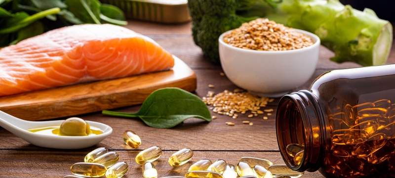 photo of vitamins, salmon steak, broccoli, spinach