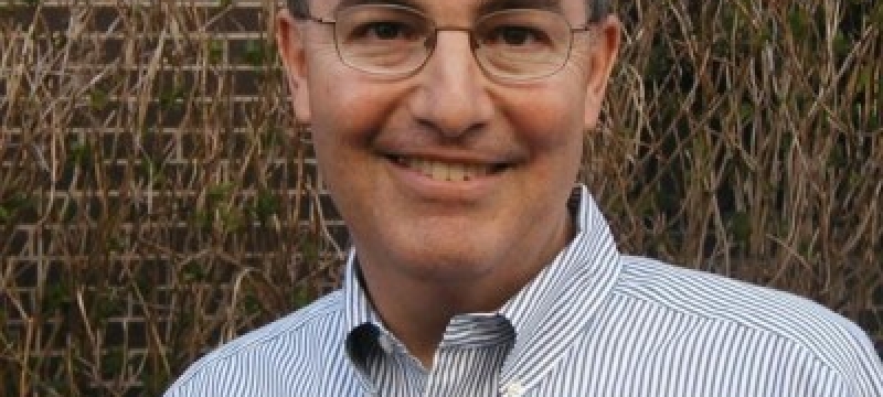 headshot photo of man, outdoors