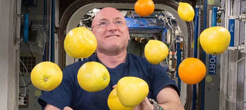 man juggling in space craft