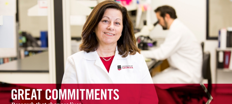 photo of woman with color graphic and man with microscope in background