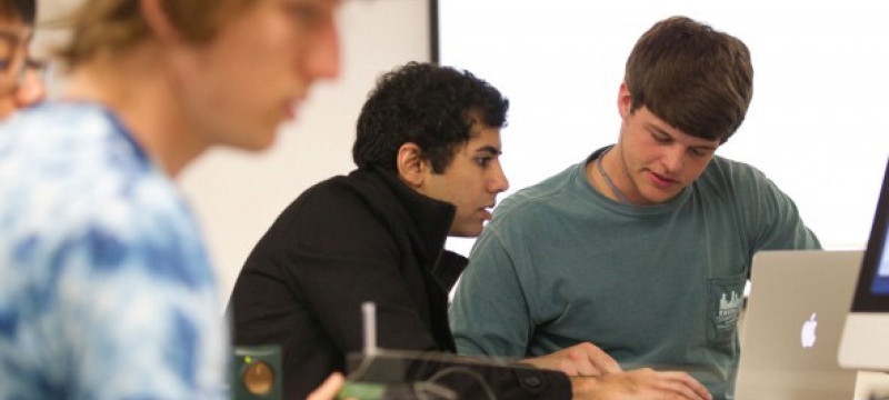 students in class, with laptop