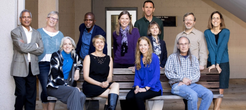 group photo of people outside daytime, four sitting, eight standing