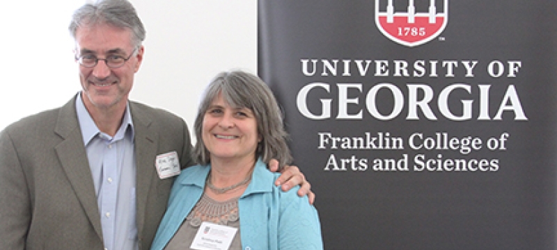 photo of man and woman with plaque