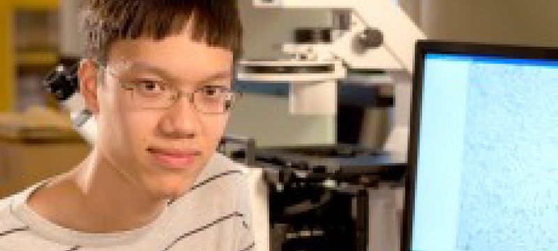 student with computer