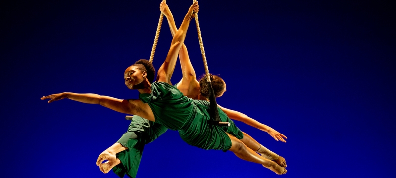 photo of two aerial dancers in performance