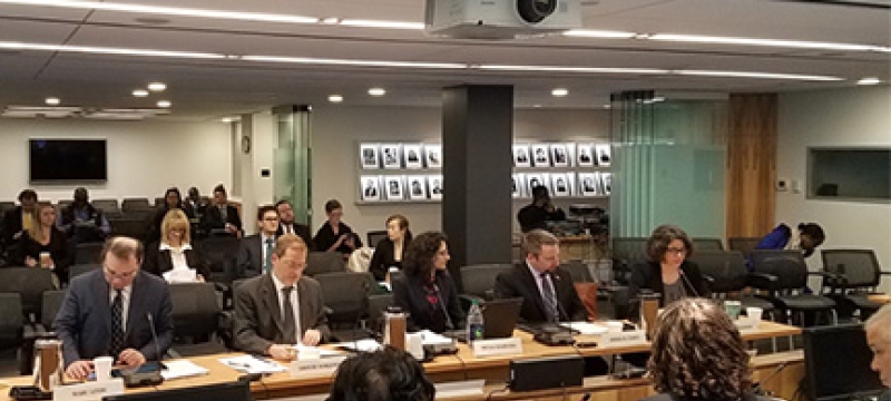 people seated in a briefing room