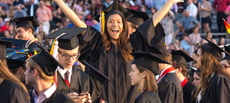 group of grads with women at center