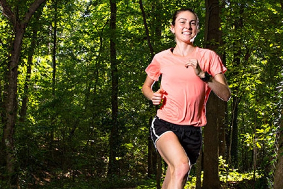 woman running in the woods