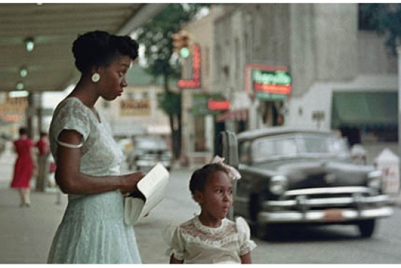 woman with girl near street