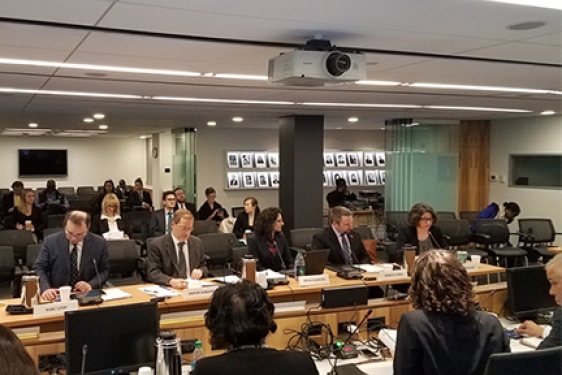 people seated in a briefing room