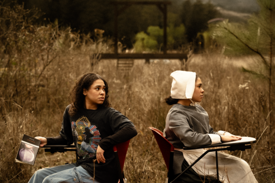 photo oto two people, in field, with desks, day