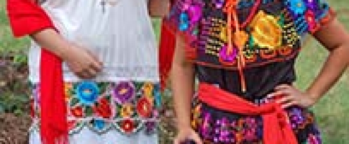 dancers in traditional Aztec costume