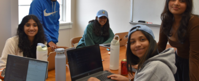 photo of five people with laptop computers