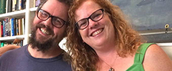 man and woman smiling