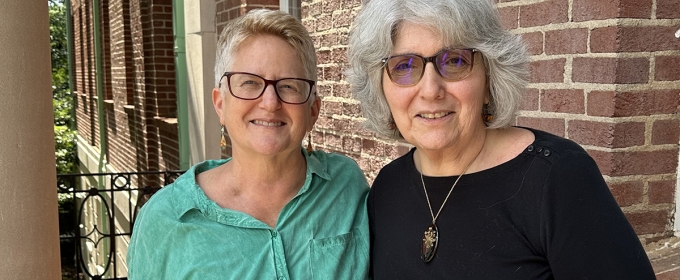 photo of two people, building in background, day