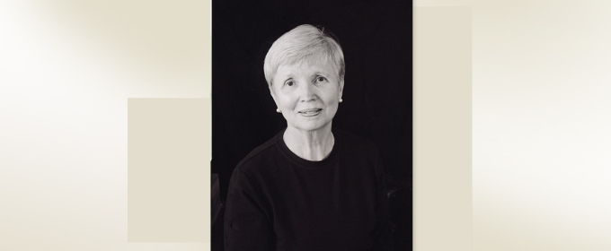 headshot of woman on black back ground with color block