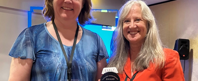 photo with two people, one with award
