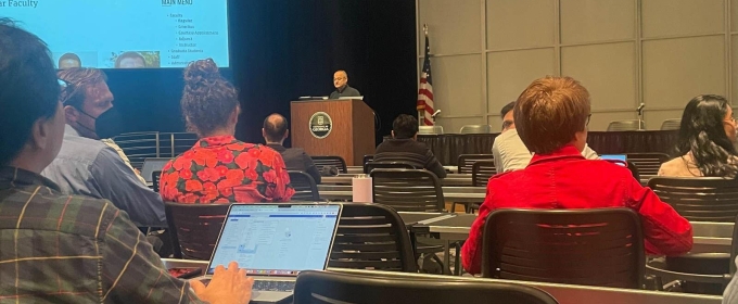 photo of conference and speaker at podium