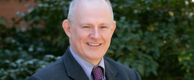 headshot photo of man, outdoors, day